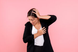front-view-young-female-dark-jacket-suffering-from-headache-pink-background