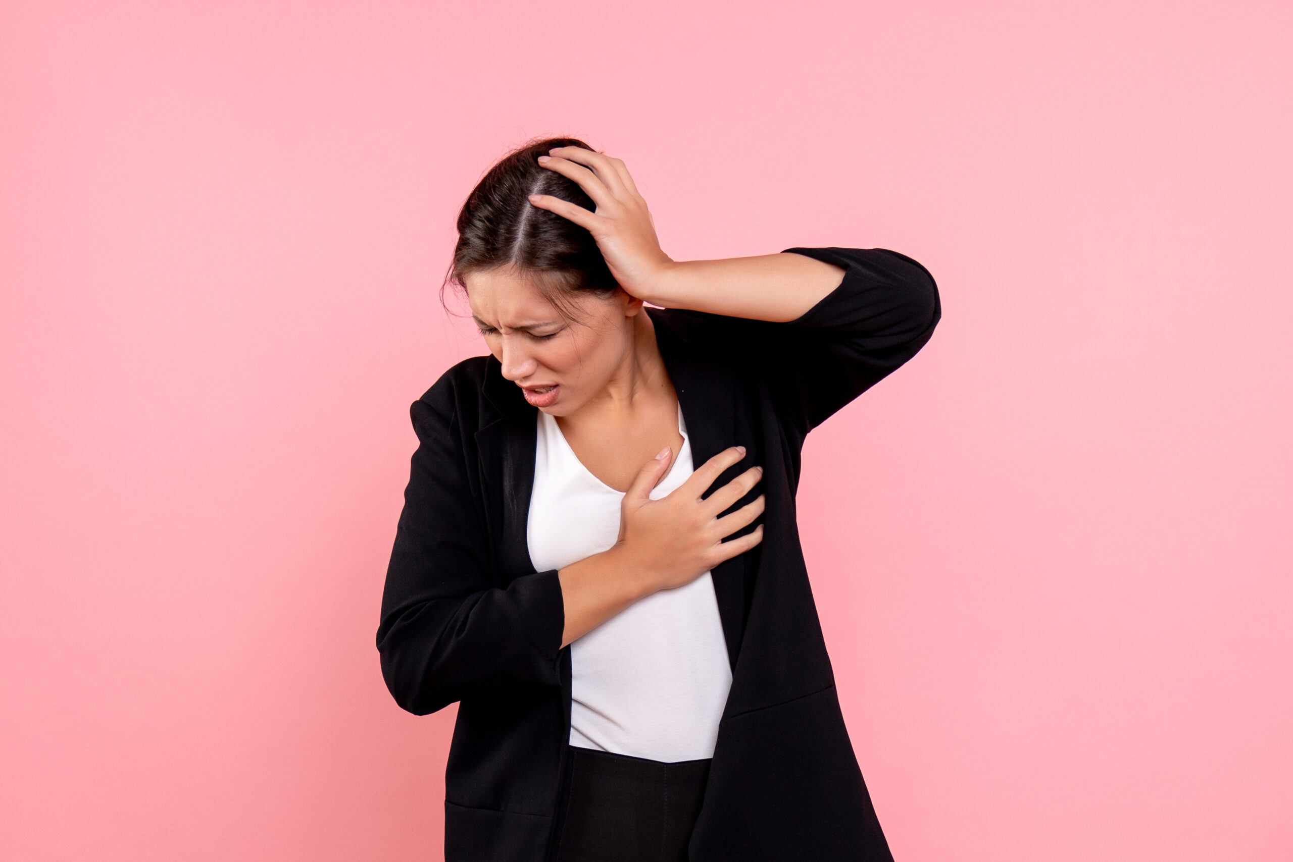 front-view-young-female-dark-jacket-suffering-from-headache-pink-background